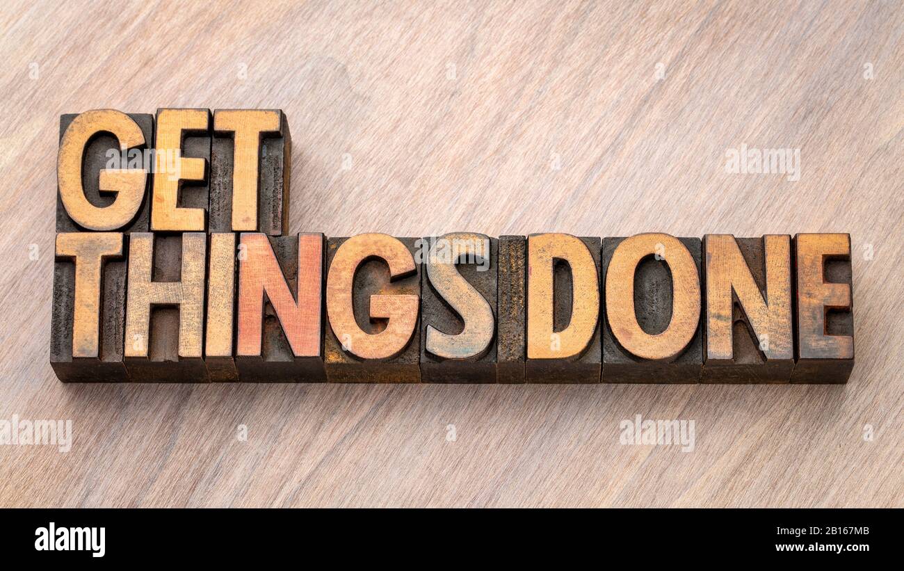 get things done - word abstract in vintage letterpress wood type blocks, motivation and business productivity concept Stock Photo