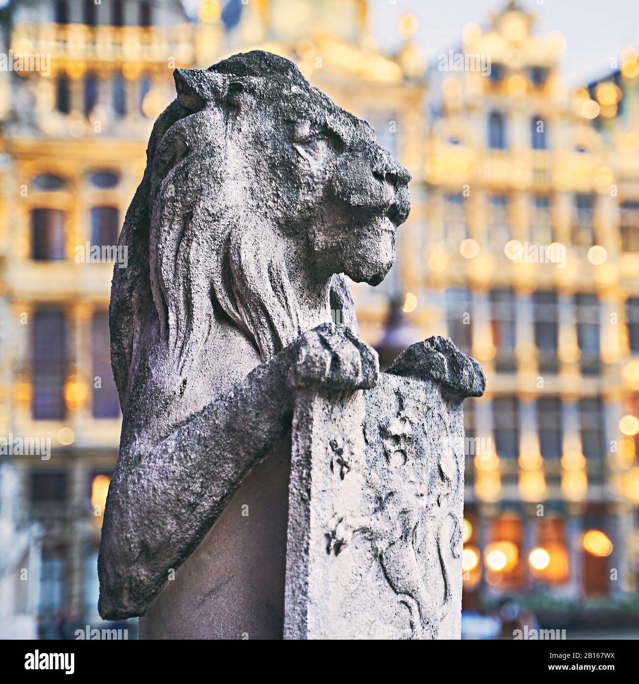 Lion Statue at the Grand Place in Brussels, Belgium at dusk Stock Photo