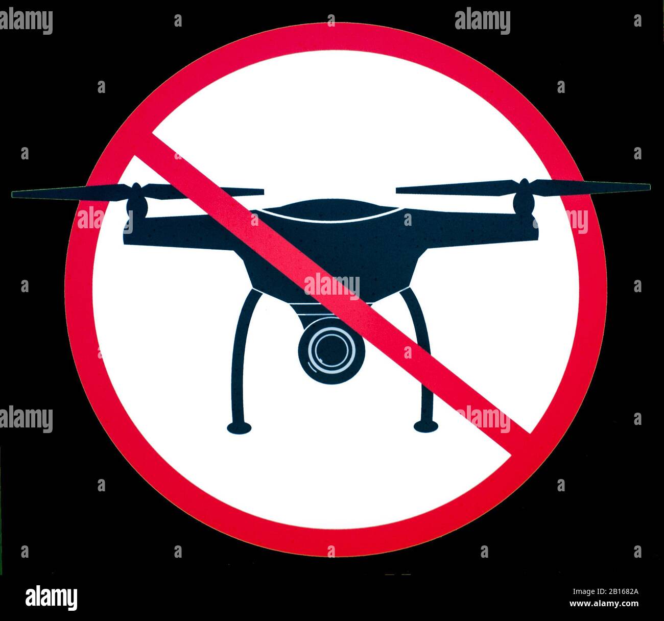 Signboard NO FLY ZONE with a picture of a dithered droning Stock Photo