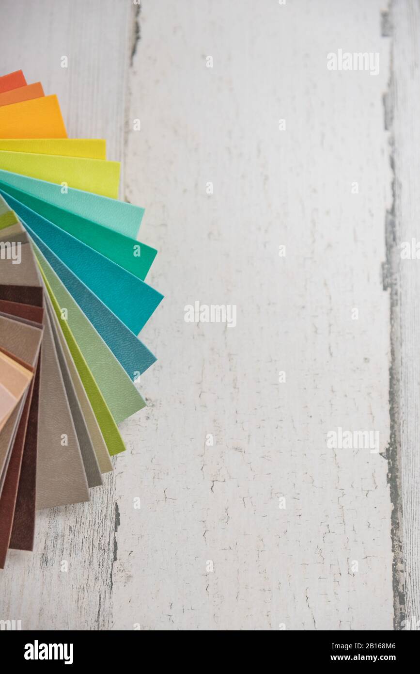 Colorful stack of sample test swatches for paint or fabric in spectrum ...
