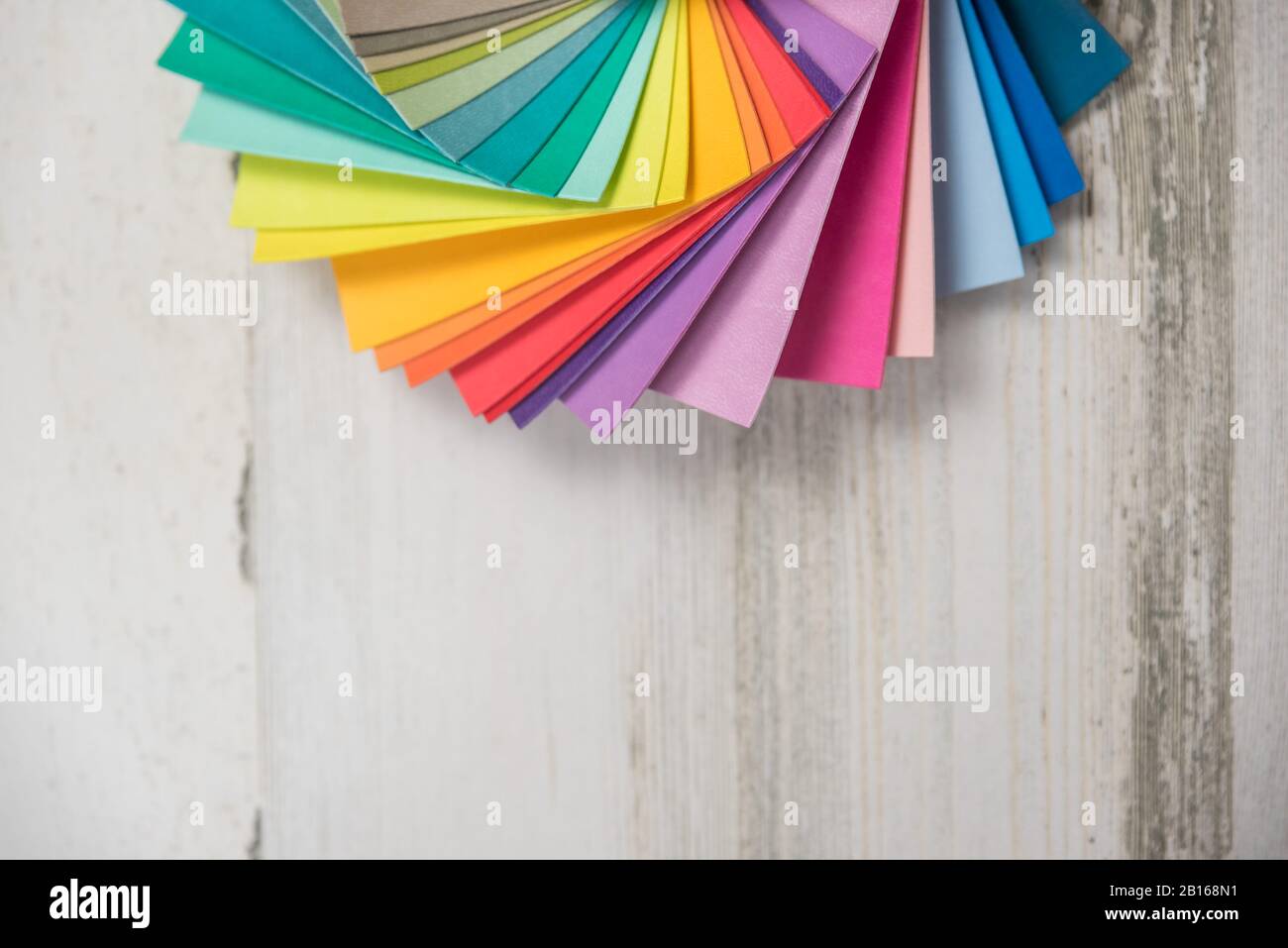 Colorful stack of sample test swatches for paint or fabric in spectrum ...