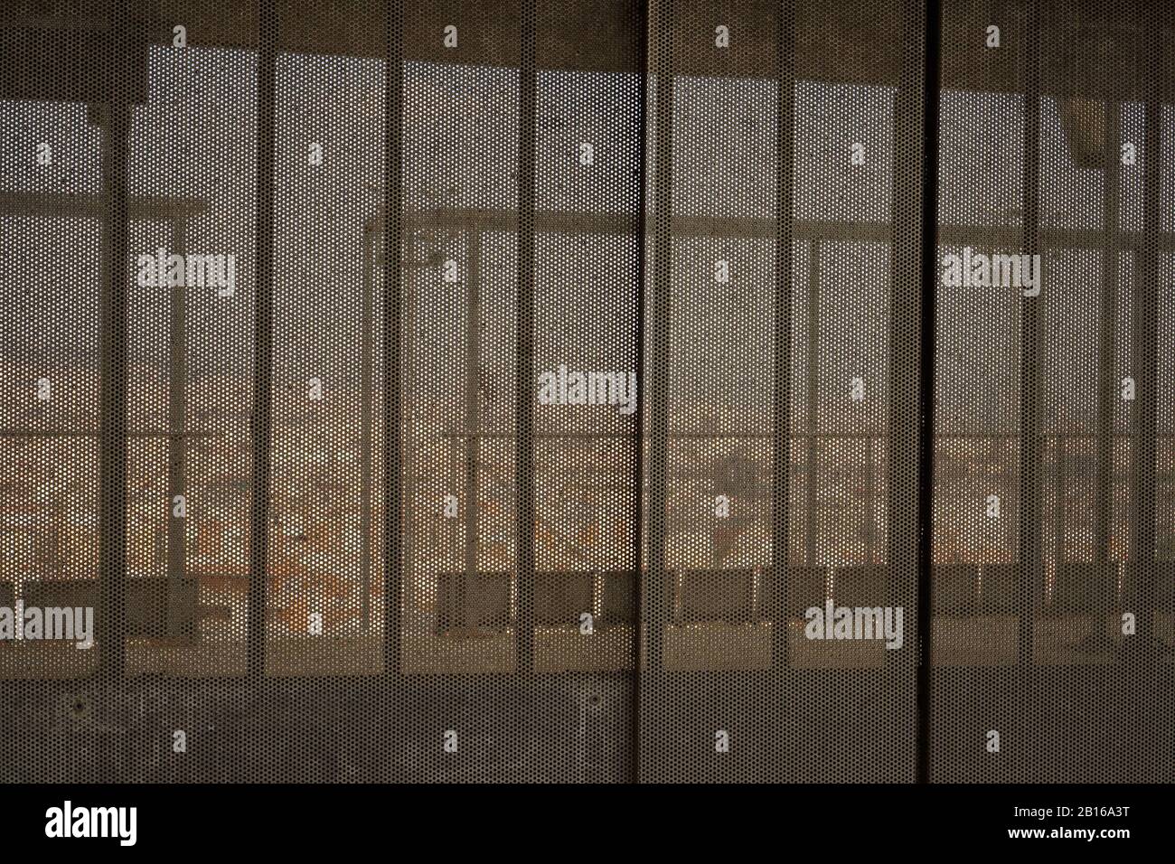 View of Barcelona city through a metal mesh wall Stock Photo