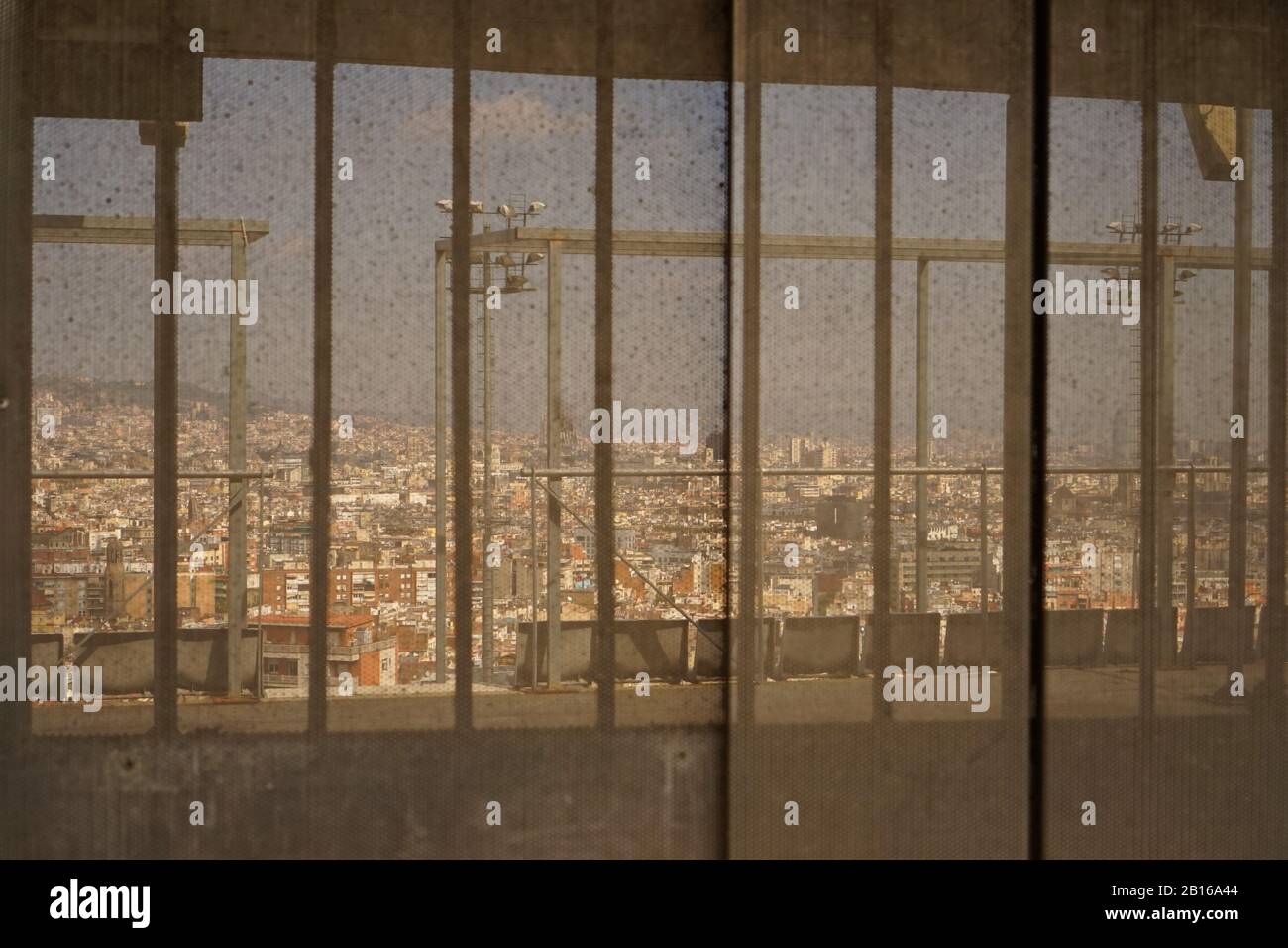 View of Barcelona city through a metal mesh wall Stock Photo