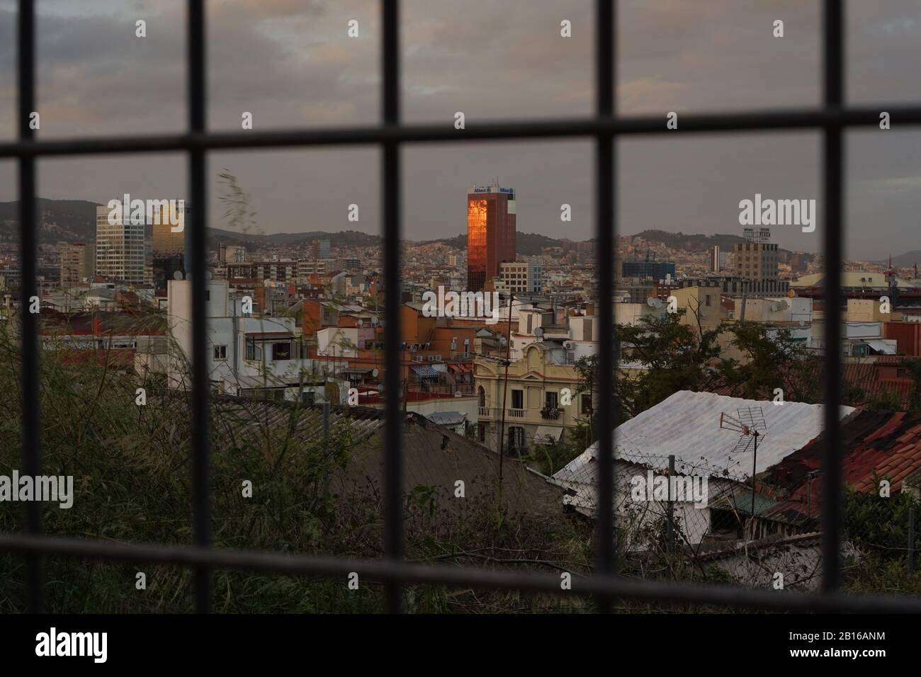 A view through a fence of the outskirts of Barcelona City Stock Photo