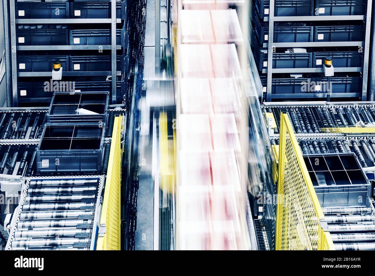 Moving lift in an automated warehouse. Stock Photo