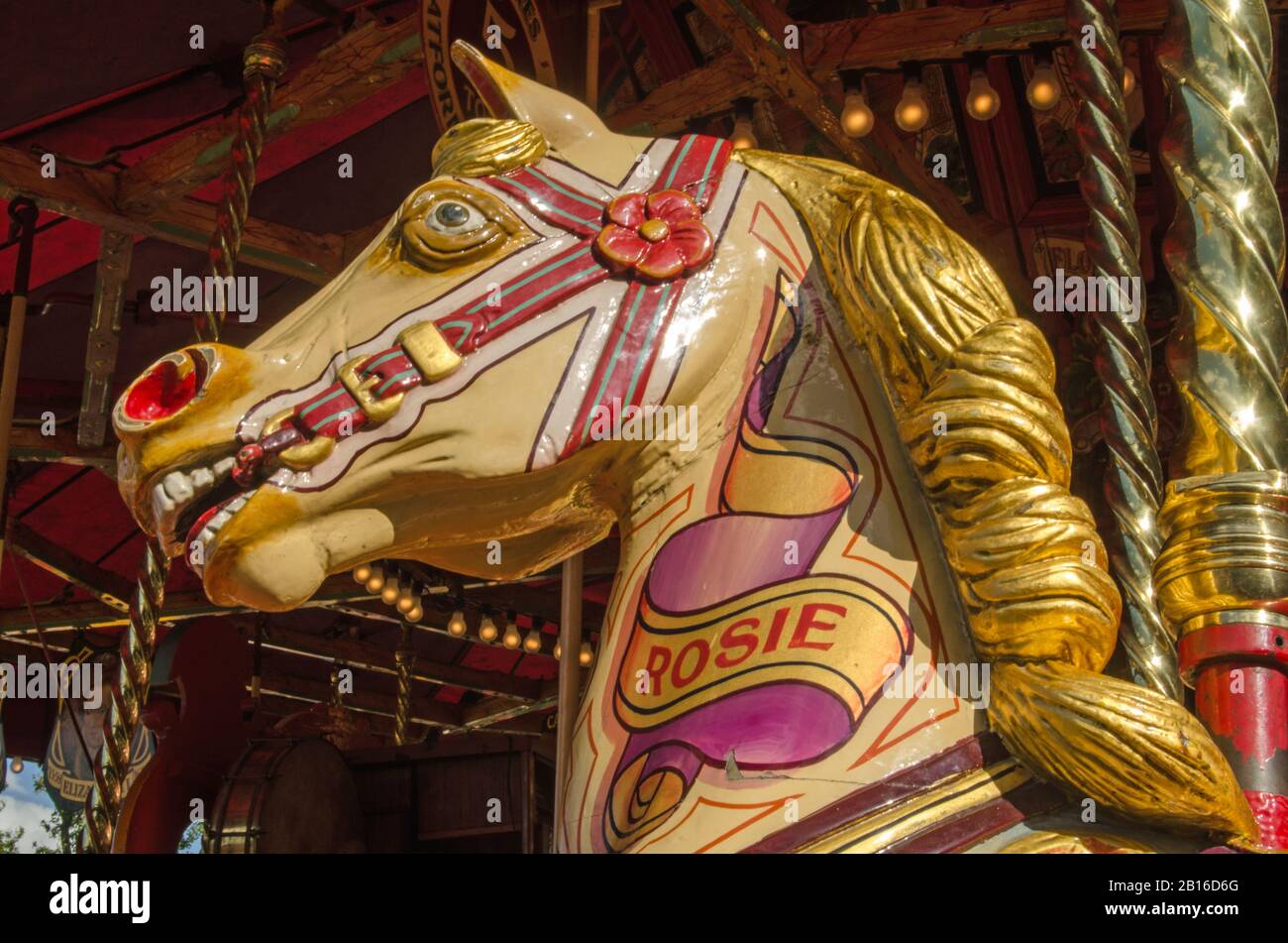 Basingstoke, UK - September 1, 2019: Painted wooden horse on the steam galloper ride of Carter's Steam Fair named Rosie. Stock Photo