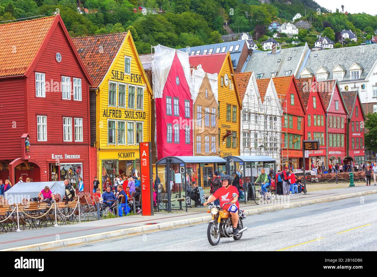 Bergen, Norway - July 30, 2018: City street view with Bryggen old wharf, people and colorful traditional houses Stock Photo