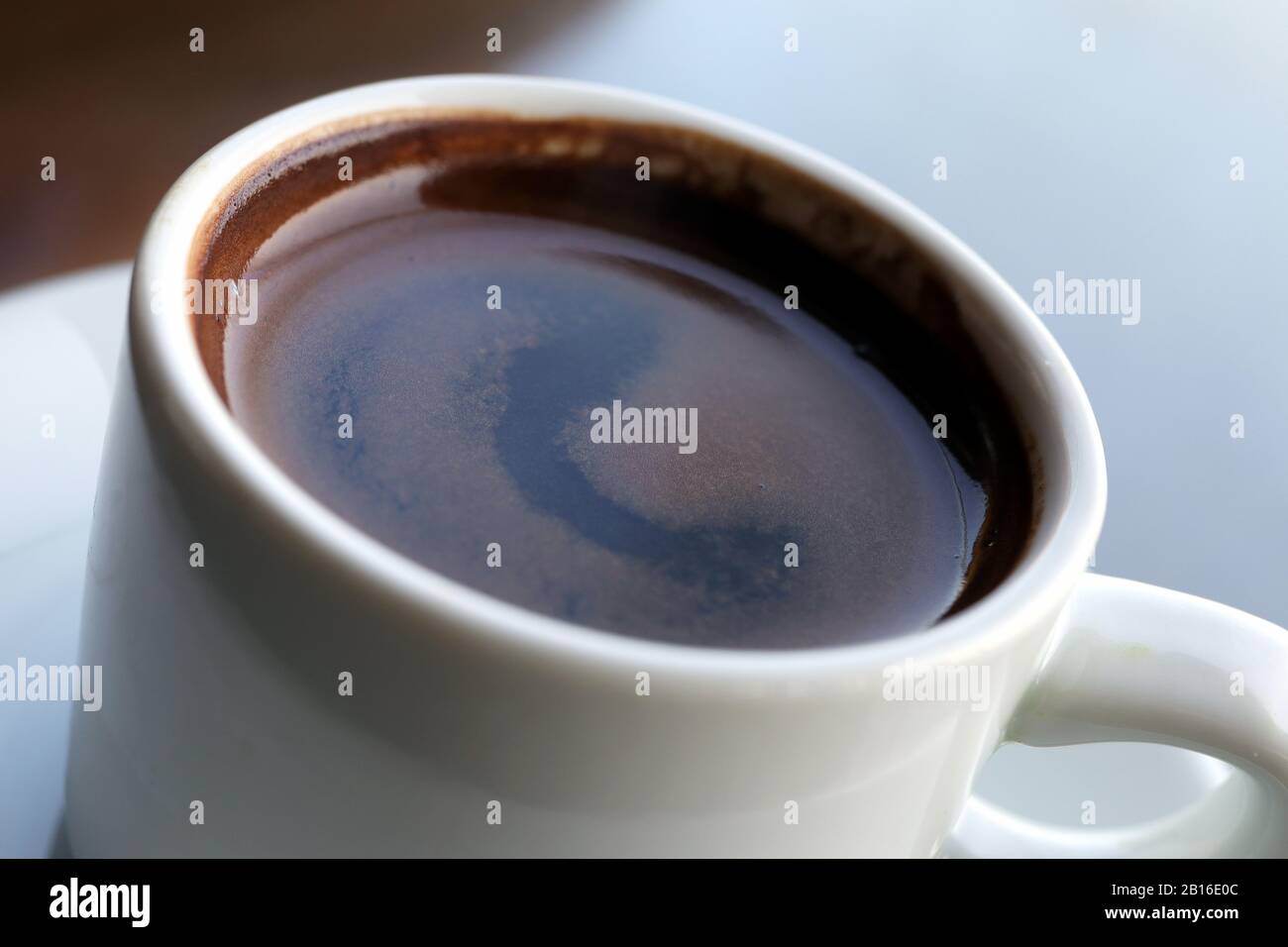 Close-up of Turkish coffee in white ceramic cup Stock Photo
