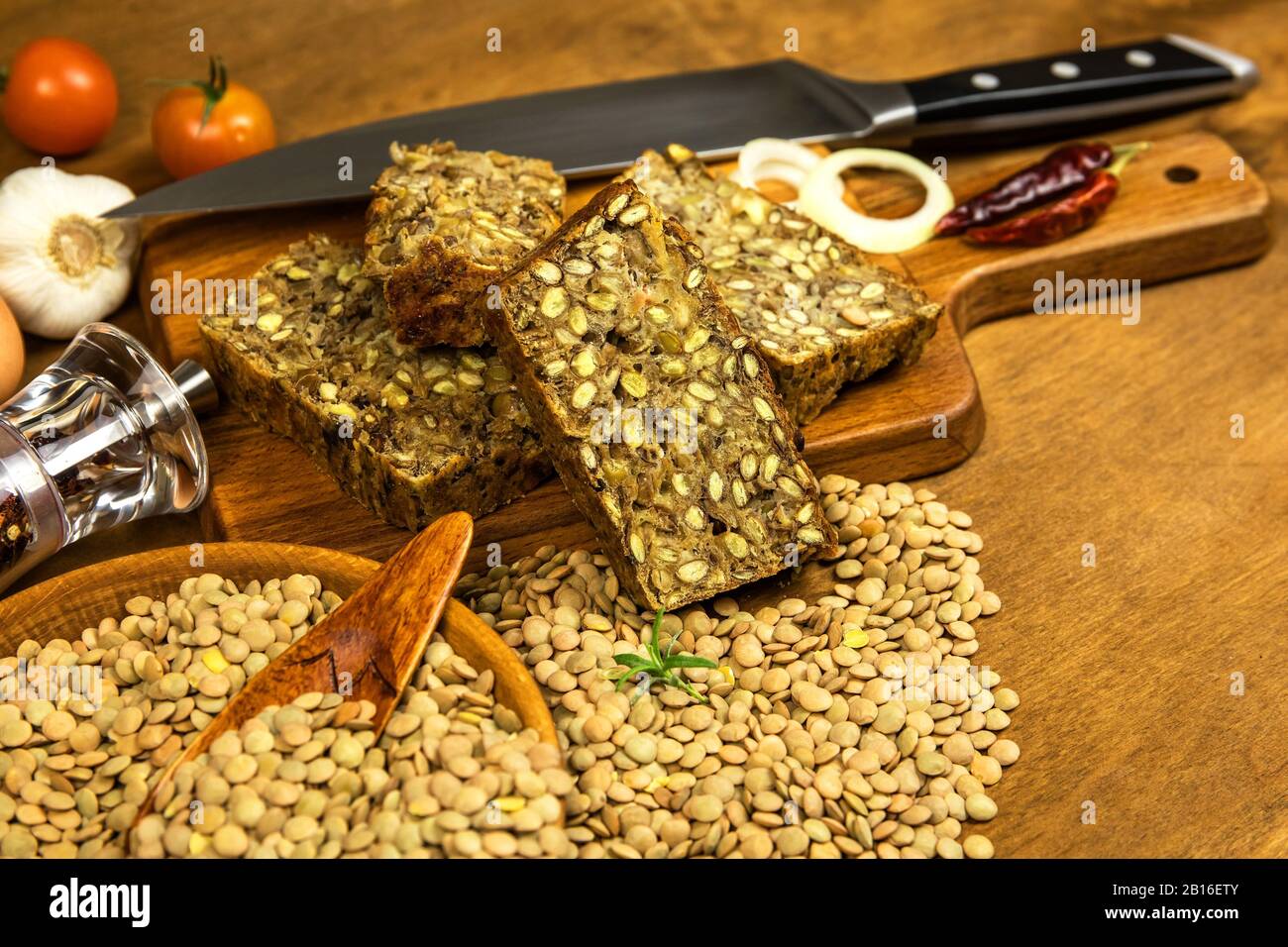 Roasted meatloaf from lentils. Vegetarian food. Legumes for lunch. Diet food. Vegetarian meat loaf. Food from lentils. Stock Photo