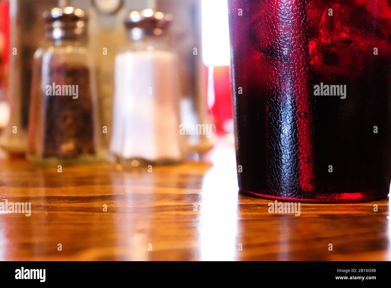 A drink with salt and pepper in th background Stock Photo