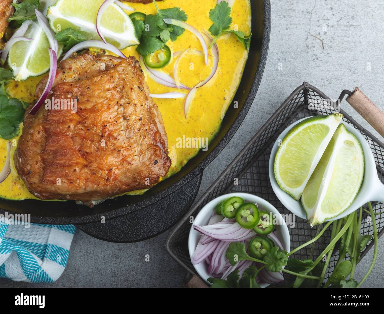 baked chicken thigh with curry sauce Stock Photo