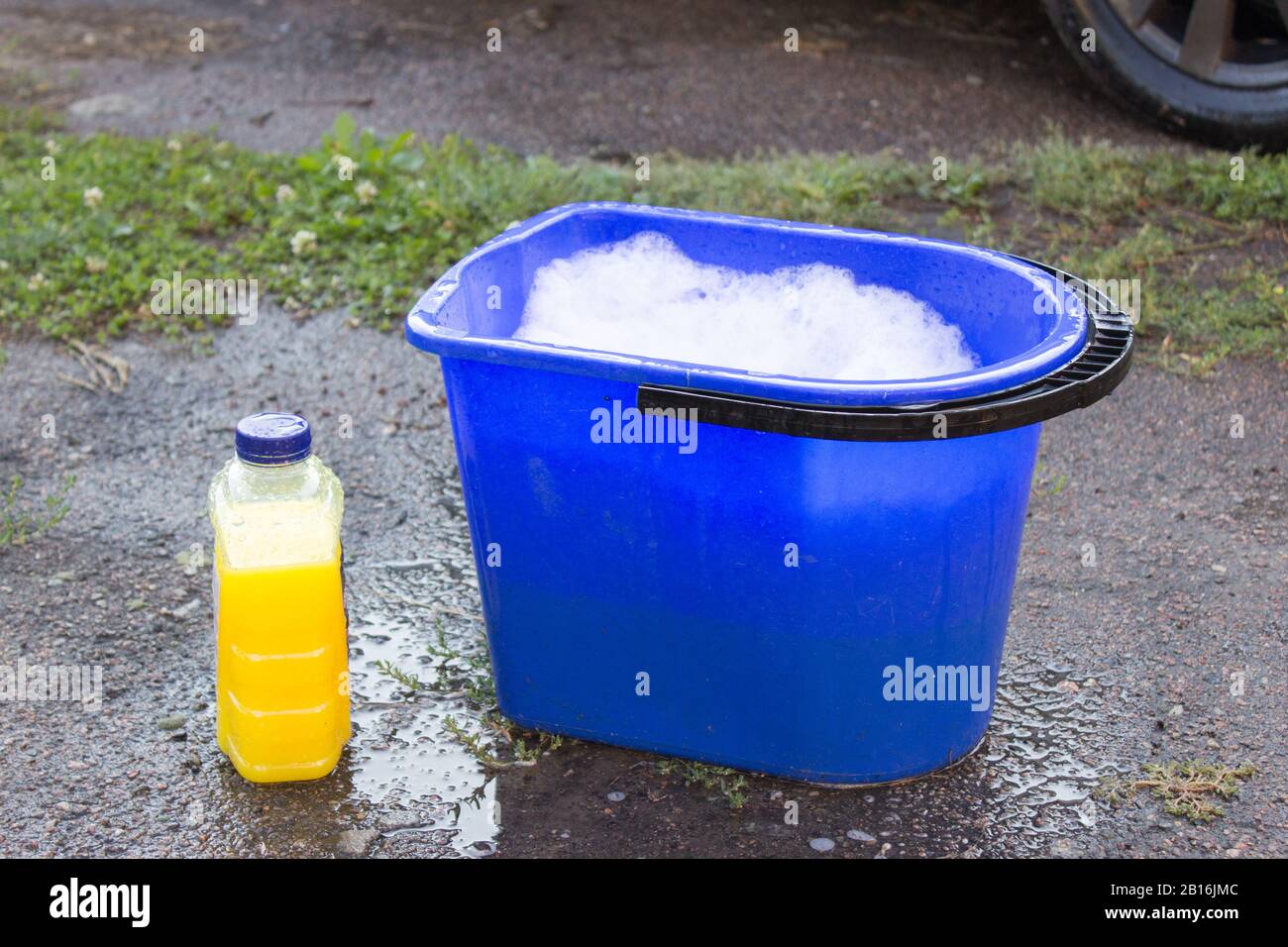 Bucket full of soap suds and hand washing Stock Photo - Alamy