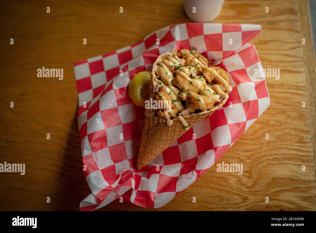 Southern fried shrimp in a seafood waffle cone Stock Photo Alamy