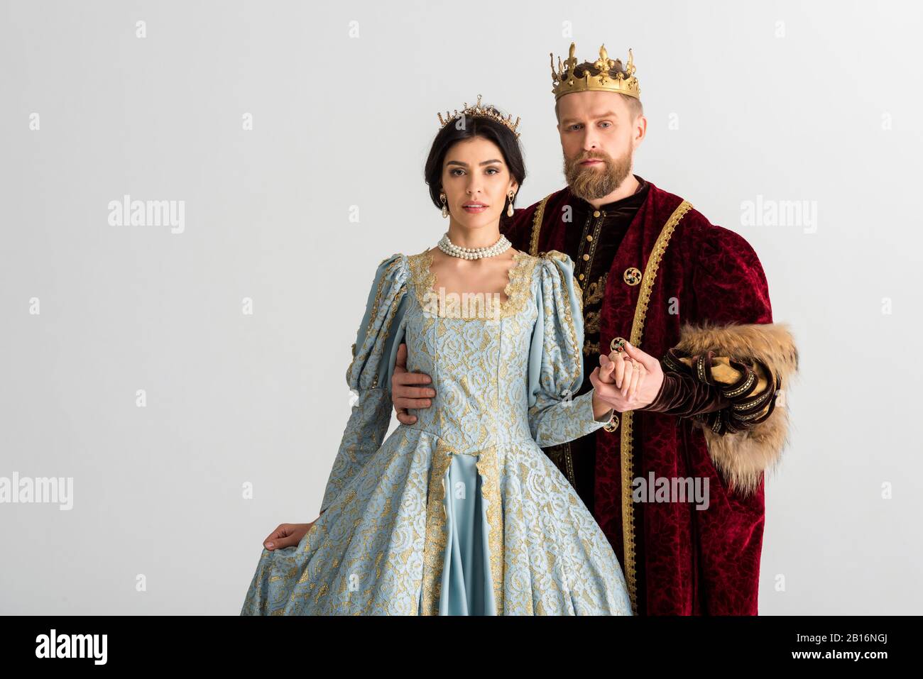 queen and smiling king with crowns holding hands isolated on grey Stock  Photo - Alamy