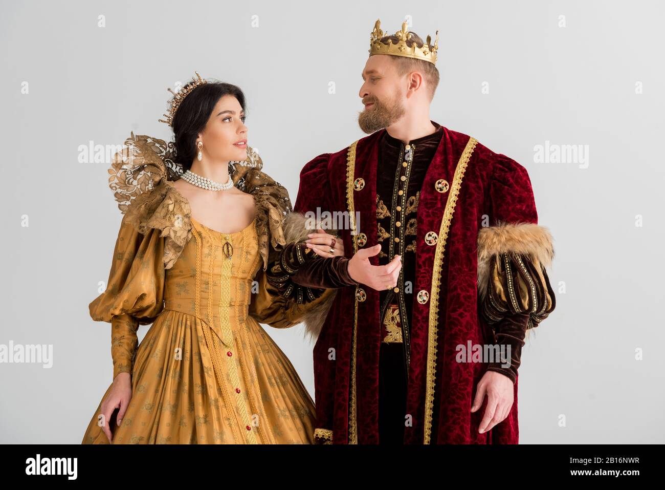 queen and smiling king with crowns holding hands isolated on grey Stock  Photo - Alamy