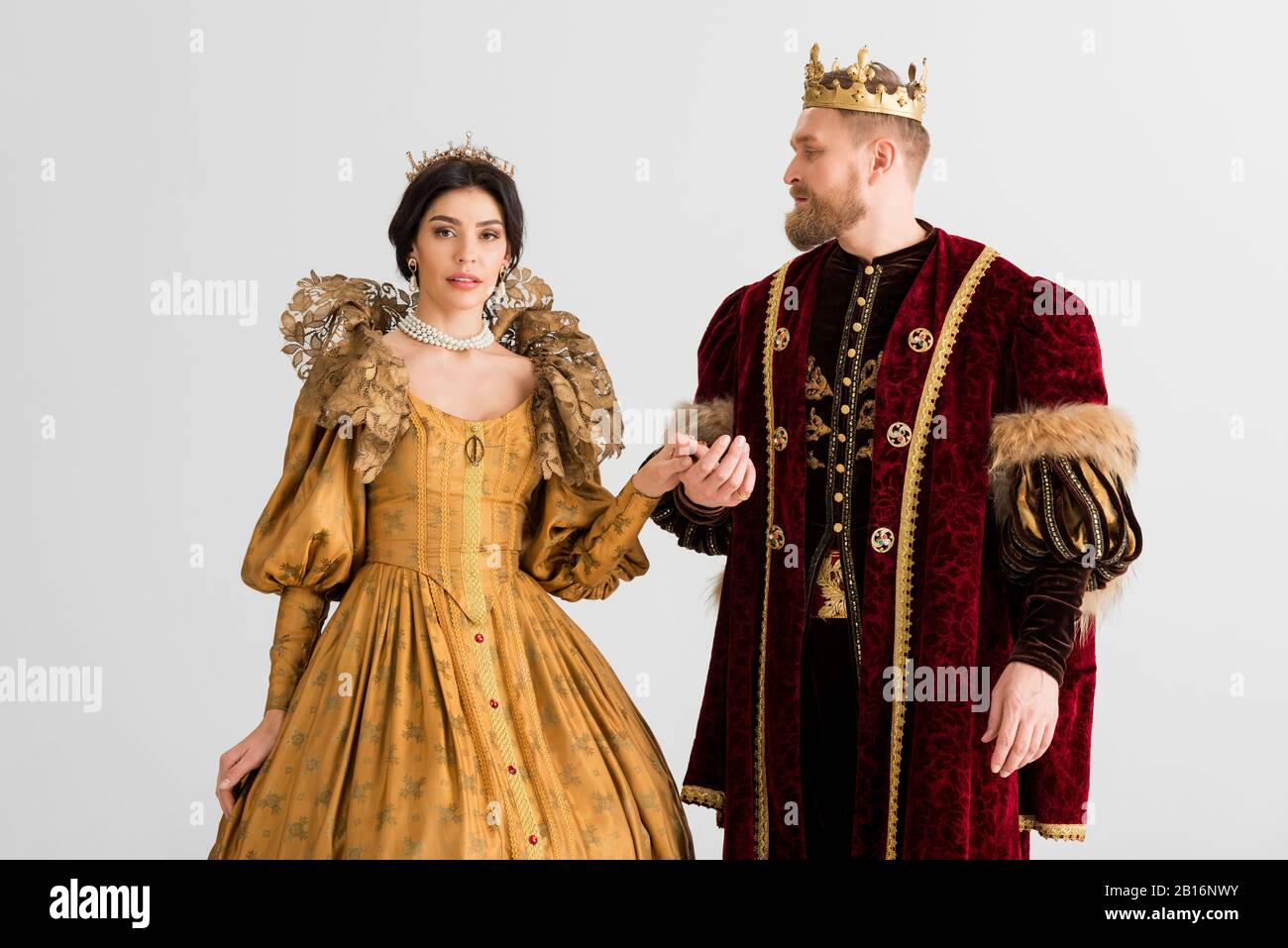 queen and smiling king with crowns holding hands isolated on grey Stock  Photo - Alamy