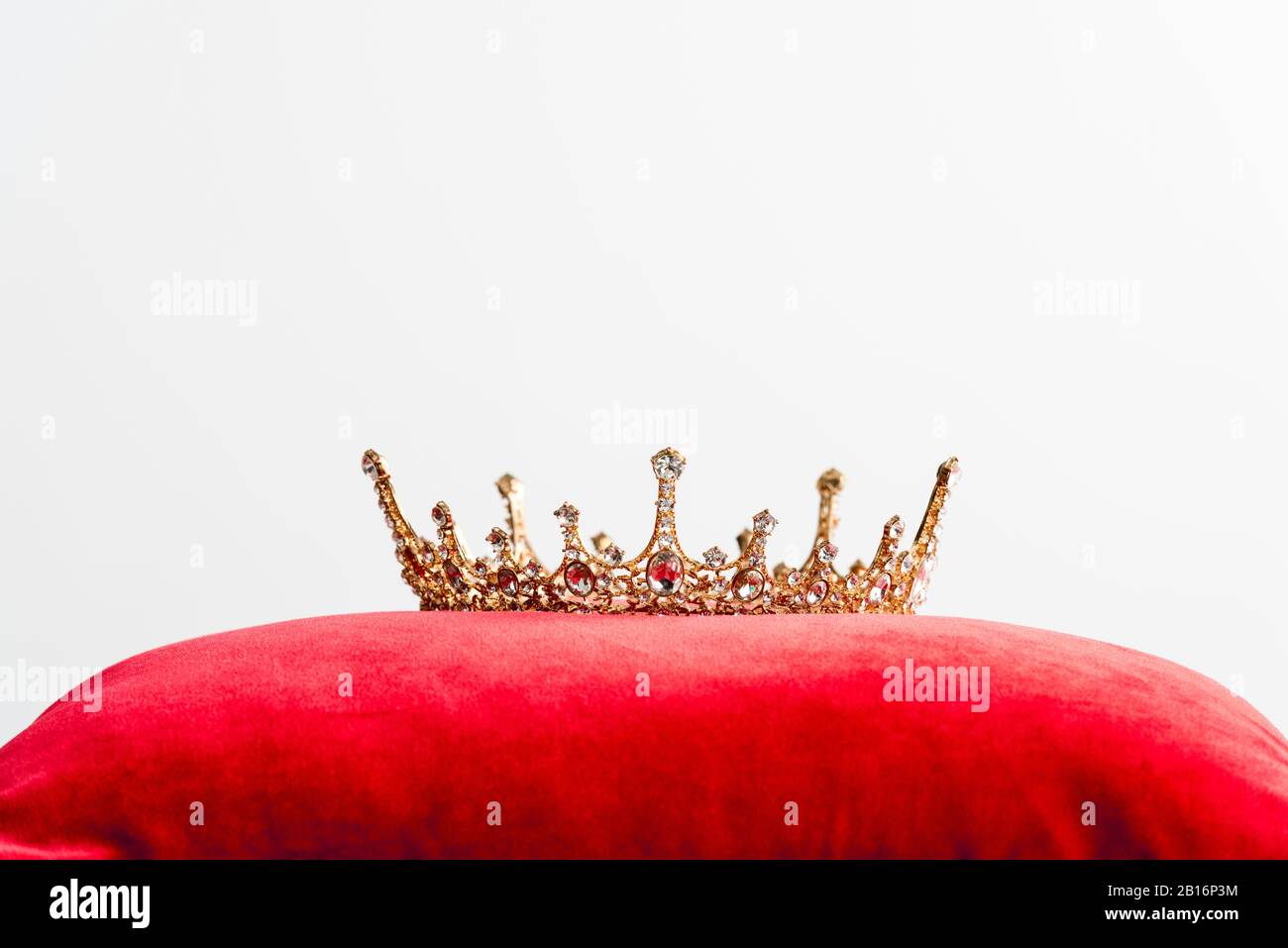 Royal gold crown on pillow hi-res stock photography and images - Alamy