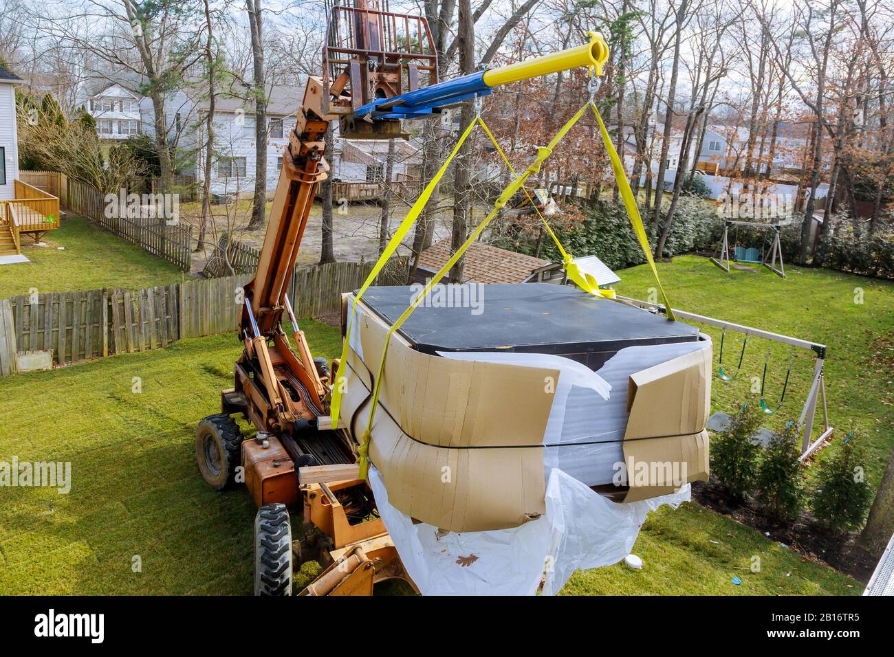 Construction details in progress boom truck forklift scale weight above blue sky with jacuzzi
