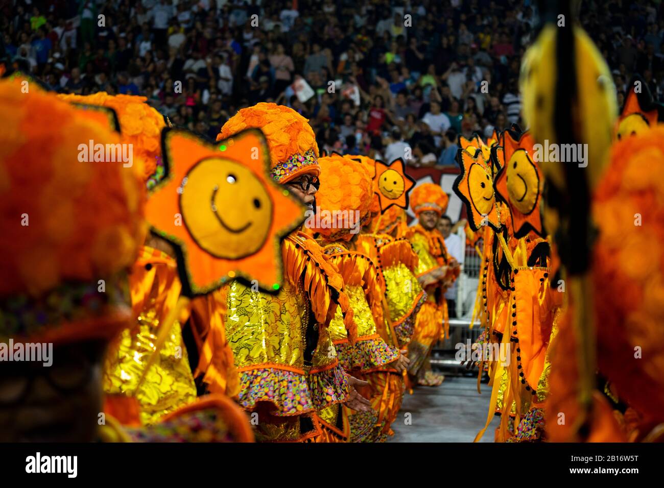 A local football team Samba school present a colorful and kid friendly parade: ''The laughter revolution' filled with clowns, jokers, movie and humour Stock Photo