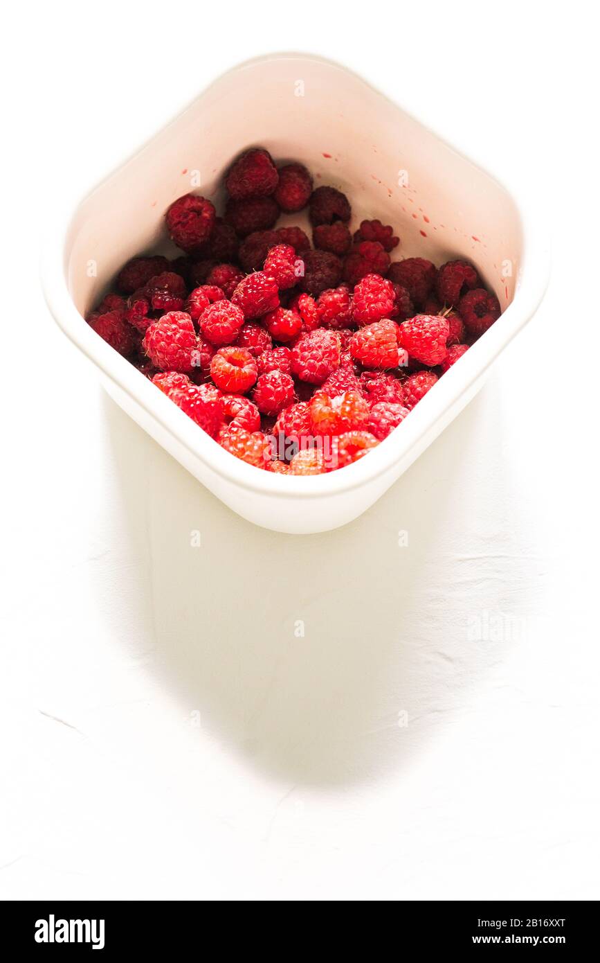 White metal container with raspberries. Fresh raspberries in packaging ...