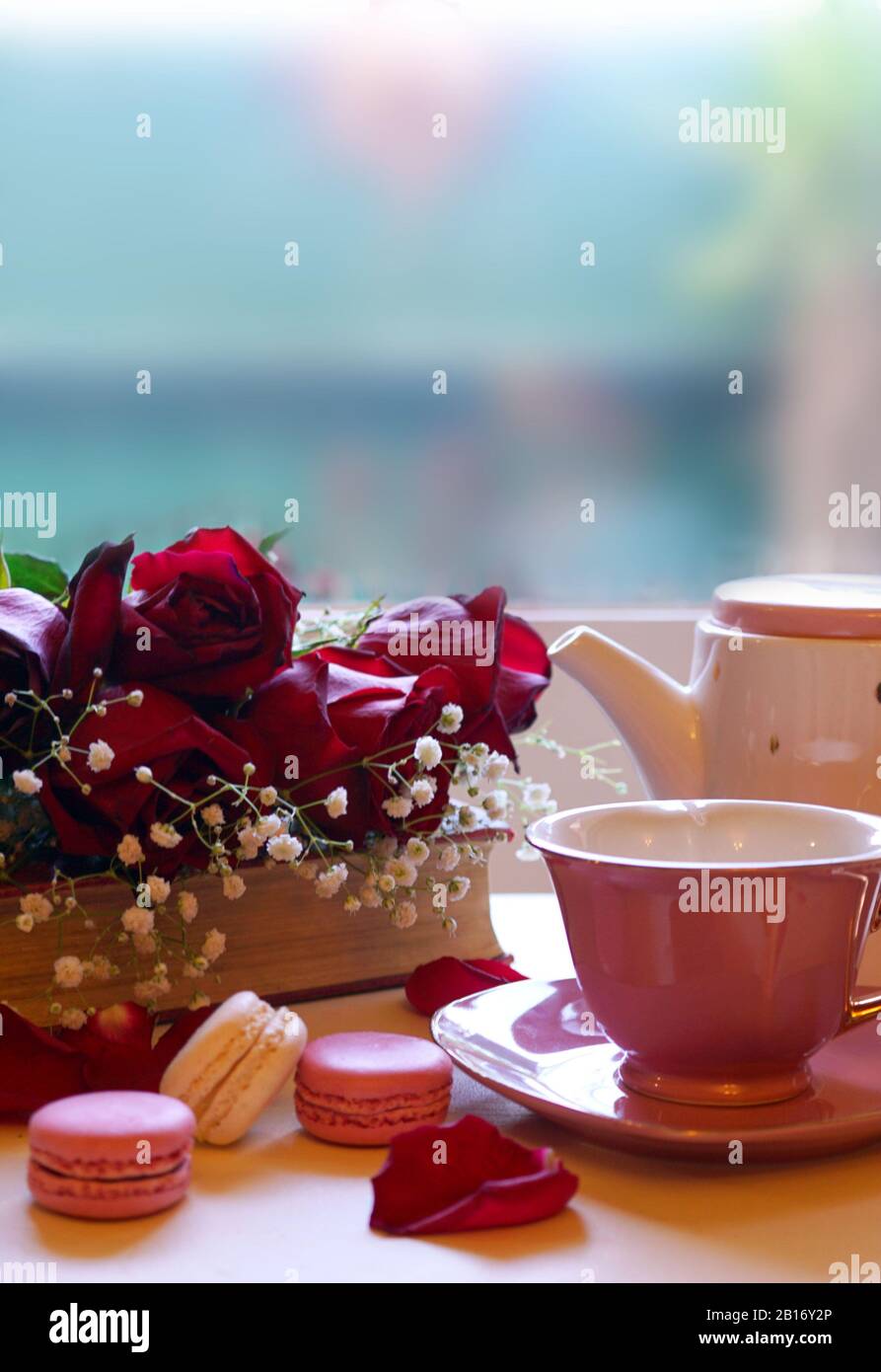 Hygge Style Nostalgic Scene Relaxing By The Window On A Cold Rainy Day With Old Books And Cup Of Tea With Negative Copy Space Stock Photo Alamy
