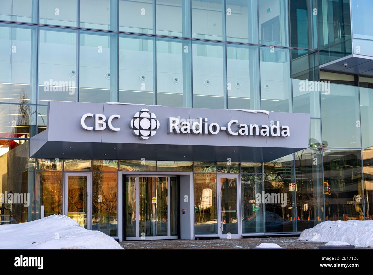 Montreal Quebec Canada February 23 2020: New CBC building in Montreal taken at the entrance with snow on the ground Stock Photo