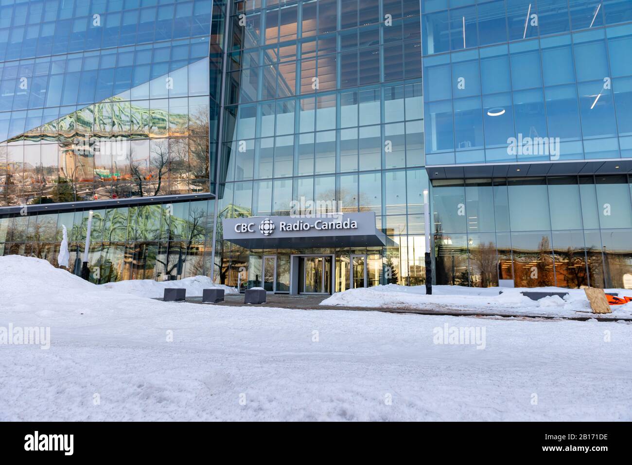 Montreal Quebec Canada February 23 2020: New CBC building in Montreal taken at the entrance with snow on the ground Stock Photo