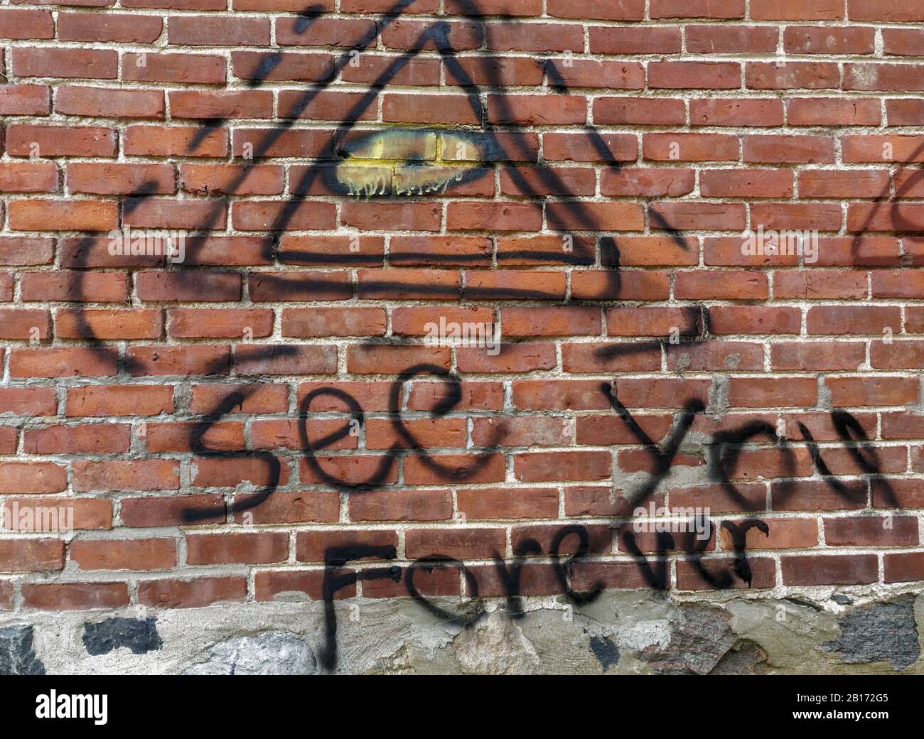 Quebec,Canada. Graffiti spray painted on a brick wall Stock Photo - Alamy
