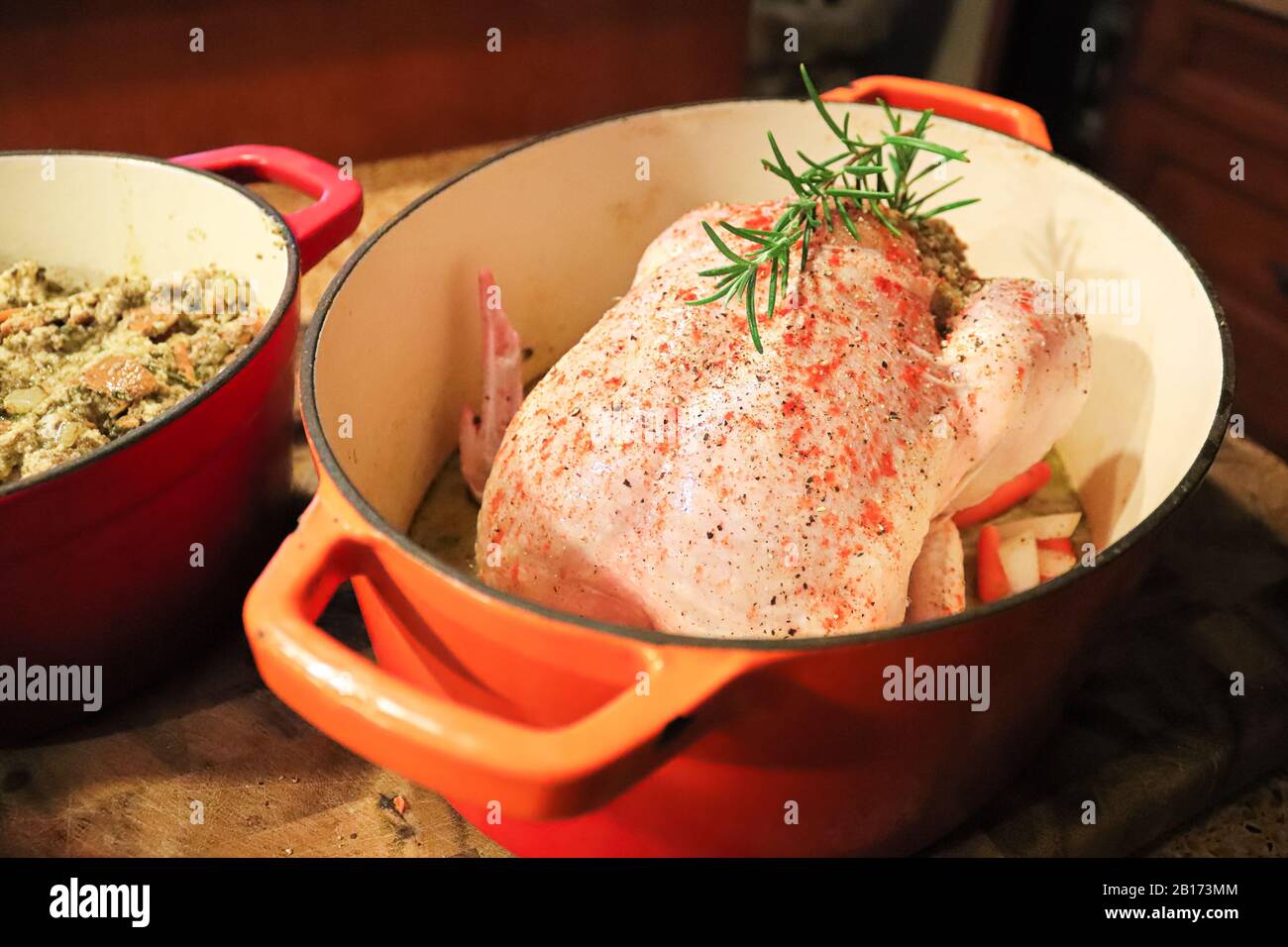 Closeup of a raw chicken and stuffing in a pot Stock Photo