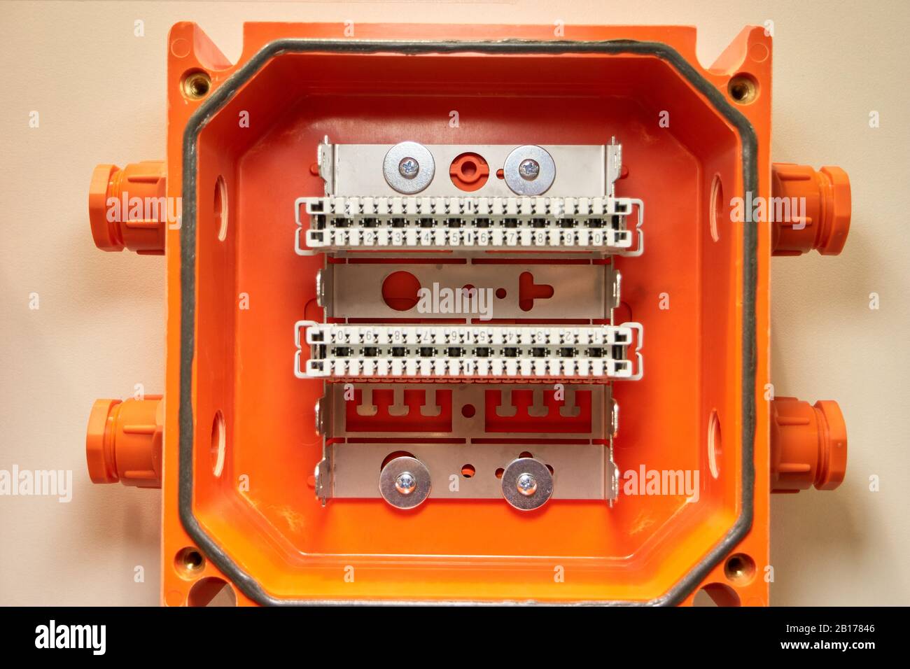 Small orange interface terminal blocks with buttons Stock Photo - Alamy