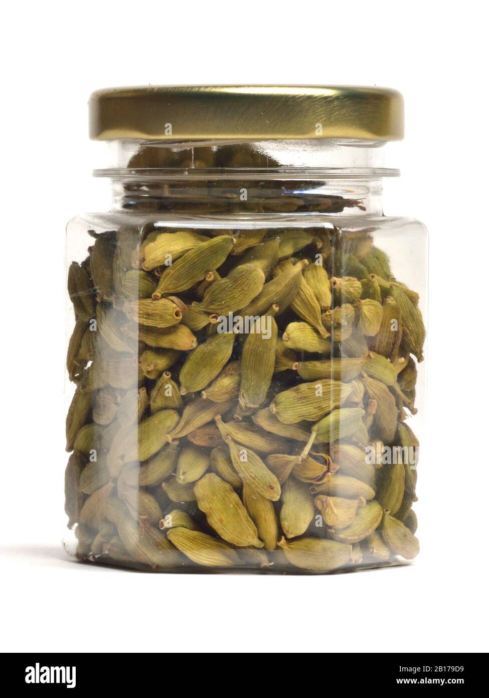 true cardamom (Elettaria cardamomum, Amomum cardamon), dried pods in a glass Stock Photo