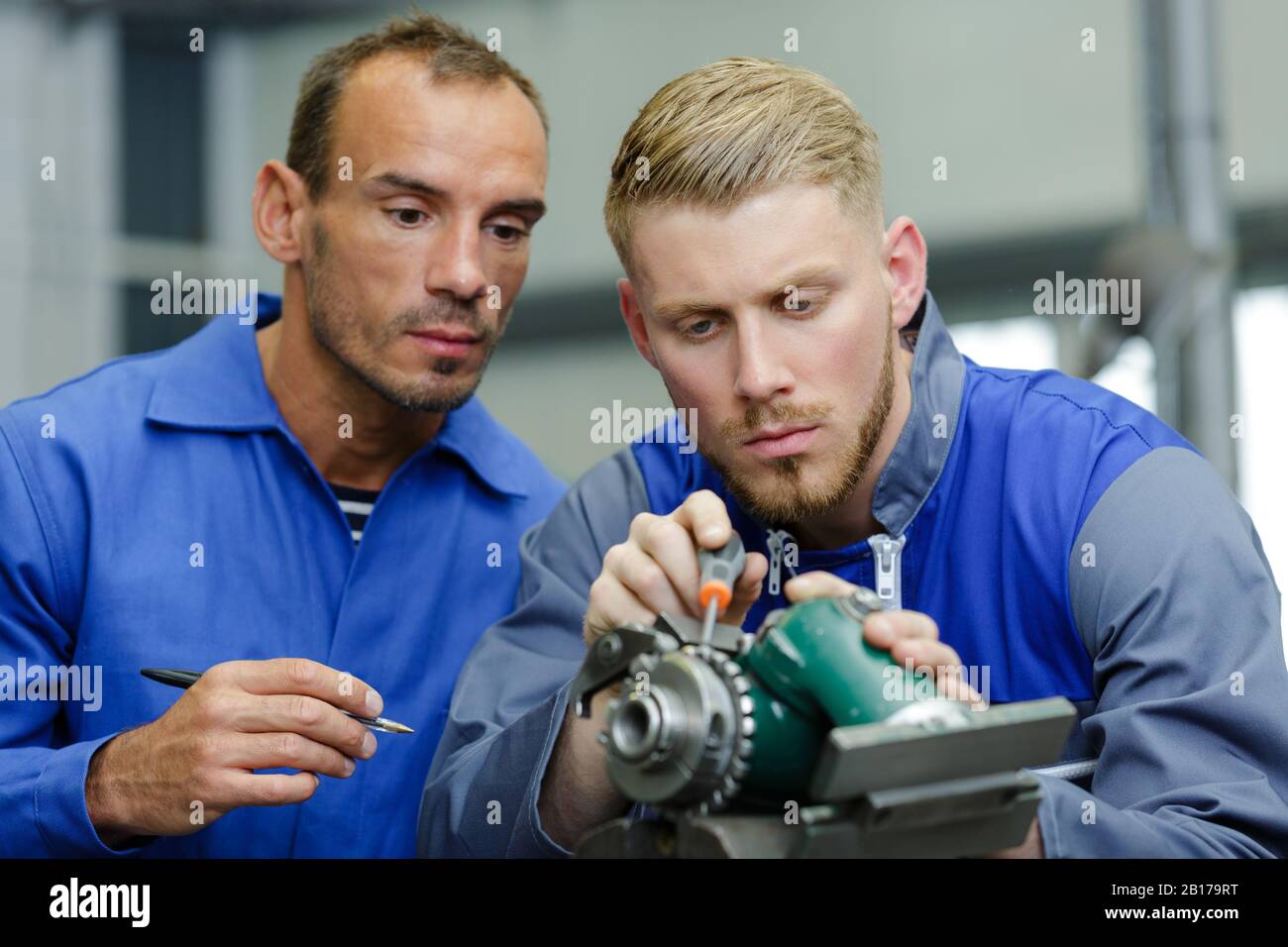 auto mobile and motorcycle mechanic working on piece Stock Photo