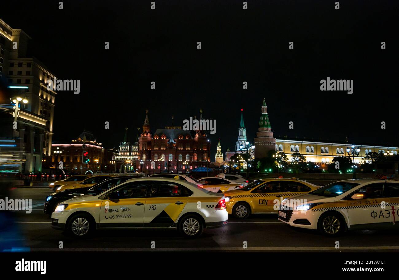 Traffic at night, Manezhnaya Square with Kremlin Towers & State Museum,  Moscow, Russian Federation Stock Photo
