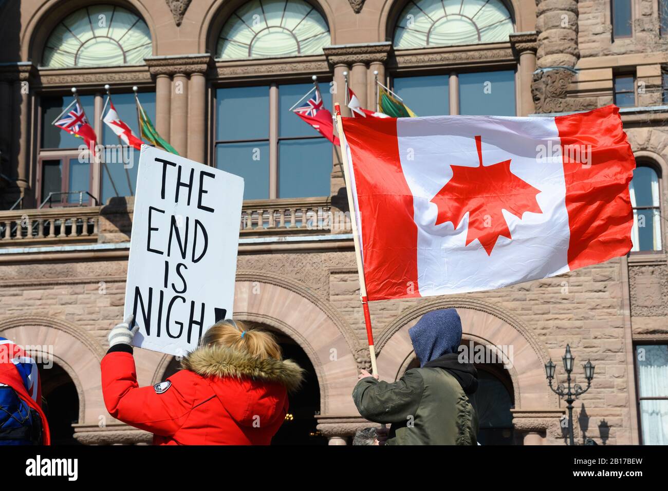 Anti-pipeline protesters denounce Canada at the Ontario Legislative Building during the Shut Down Canada protests in solidarity with the Wet'suwet'en. Stock Photo