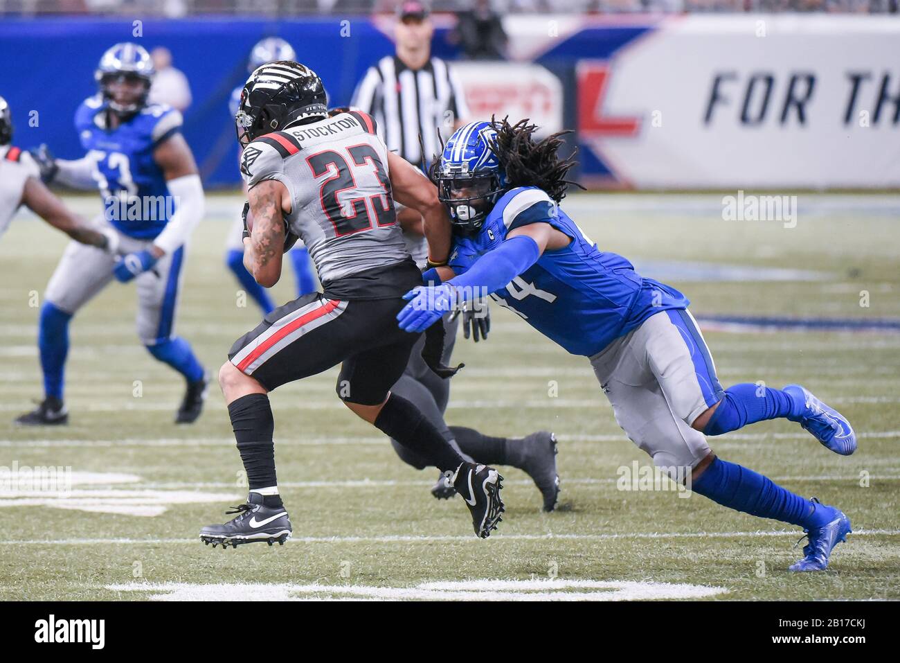 Feb 23, 2020: NY Guardians running back Justin Stockton (23) breaks through the tackle attempt of St. Louis Battlehawks safety Joe Powell (44) in a game where the NY Guardians visited the St. Louis Battlehawks. Held at The Dome at America's Center in St. Louis, MO Richard Ulreich/CSM Stock Photo