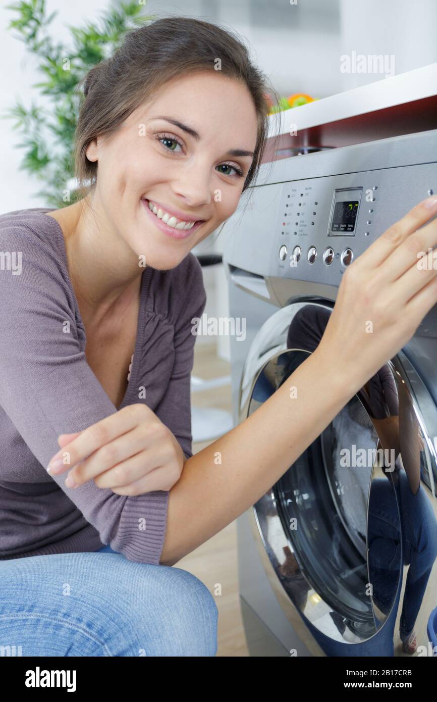 woman using a machine for washing Stock Photo