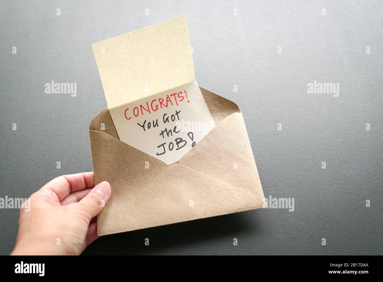 Congrats you got the job, a message inside a brown envelope. New job or