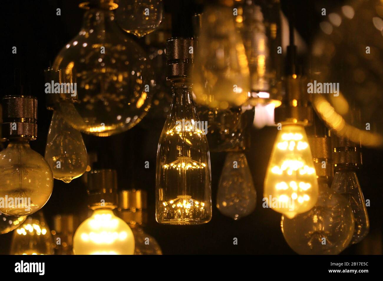 pile of LED light bulbs are decorated on the ceiling Stock Photo