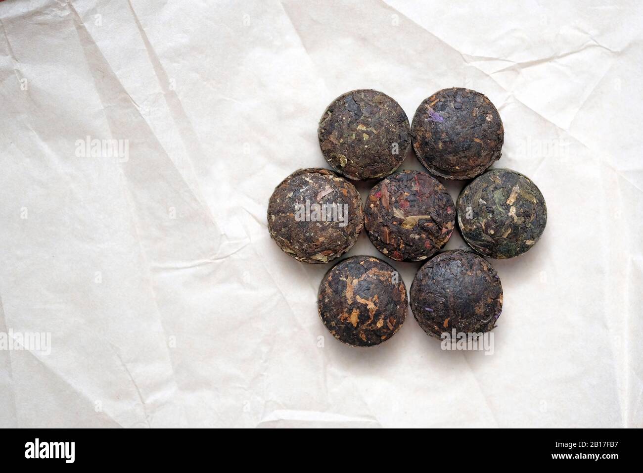 Pressed Puer Tea In The Form Of Round Tablets Black And Green Chinese Tea On Parchment Paper Top View Stock Photo Alamy Pressed Puer Tea In The Form Of Round Tablets Black And Green Chinese Tea On Parchment Paper Top View Stock Photo Alamy