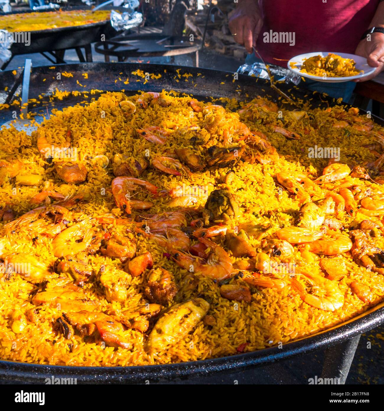 Paella on the beach cooked in a huge pan over a wood fire is the best