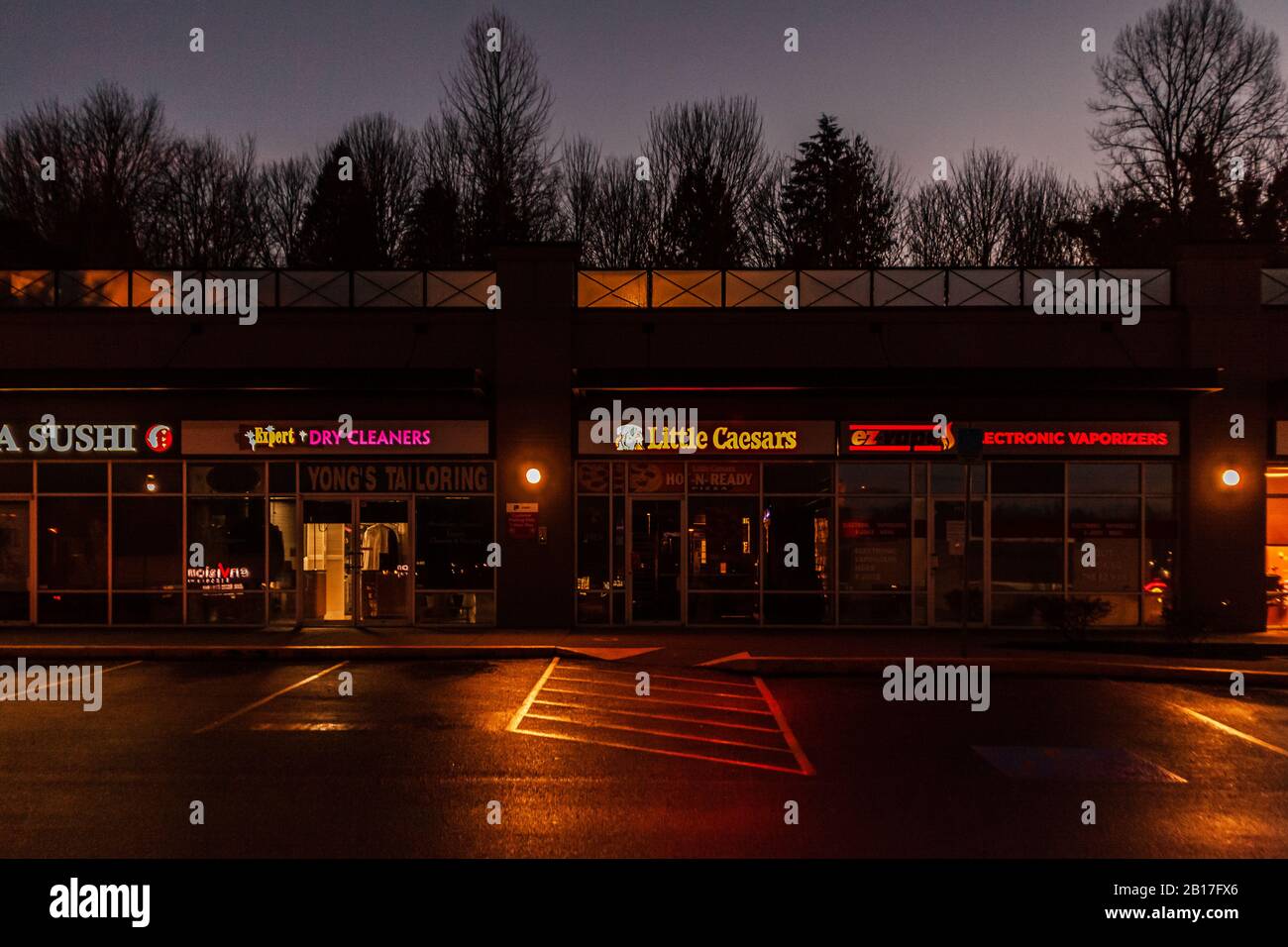 ABBOTSFORD, CANADA - FEBRUARY 10, 2020: retail store strip mall in early morning. Stock Photo
