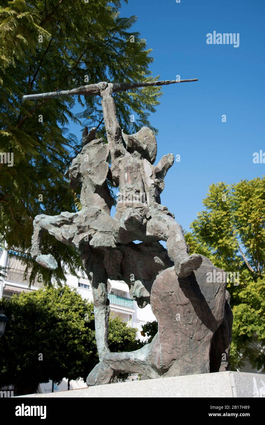 Modern Statue of Don Quixote in the street in Nerja in southern Spain. Don Quixote became so entranced by reading chivalric romances he becomes insane Stock Photo