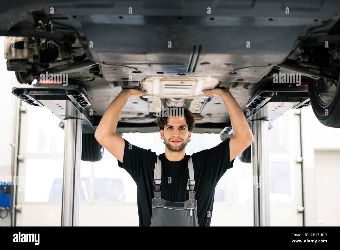 Portrait of a confident car mechanic in a workshop Stock Photo