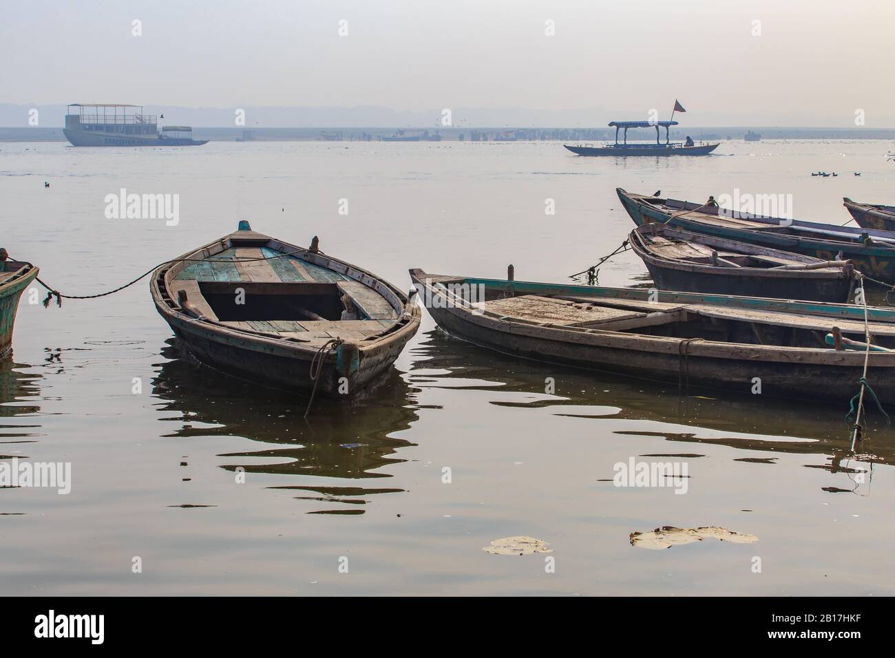 Old boats on river Ganga in Varanasi, Uttar Pradesh, India. Mornig time, sunrise. Stock Photo