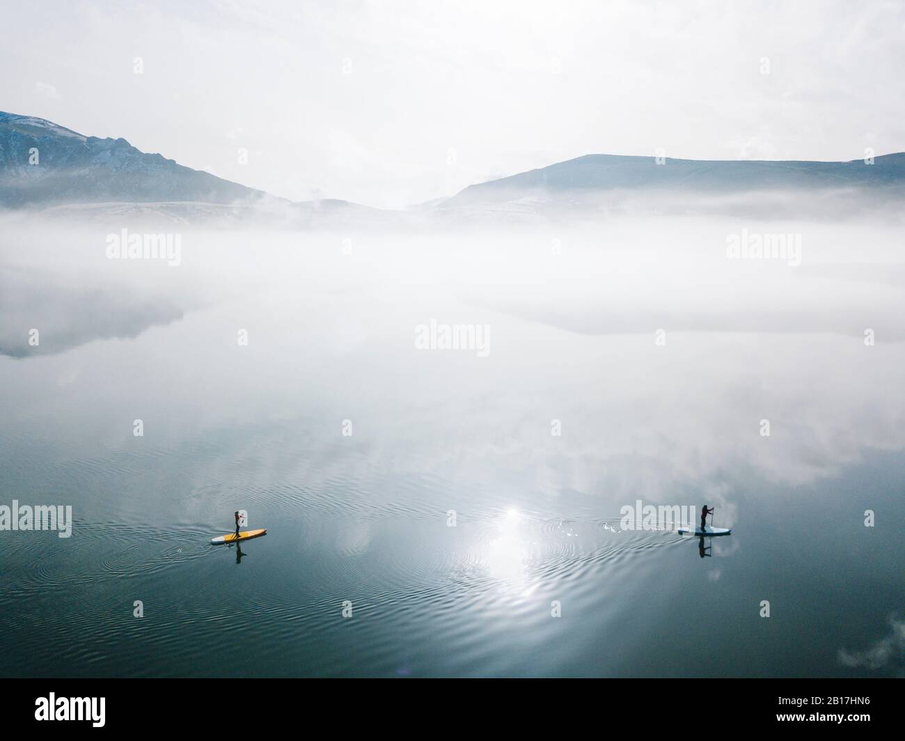 Aerial view of two people stand up paddle surfing, Leon, Spain Stock Photo