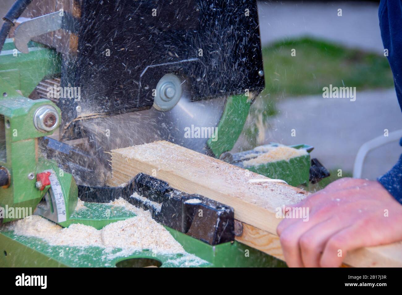 Man cutting wood using the circular saw Stock Photo