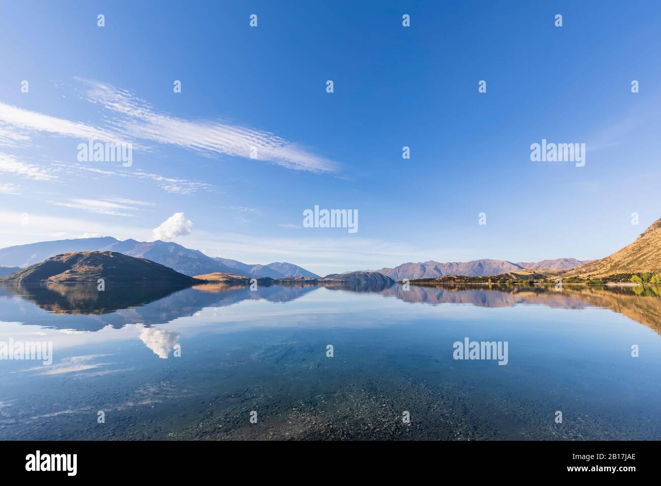 New Zealand, Queenstown-Lakes District, Wanaka, Hills reflecting in Lake Wanaka Stock Photo