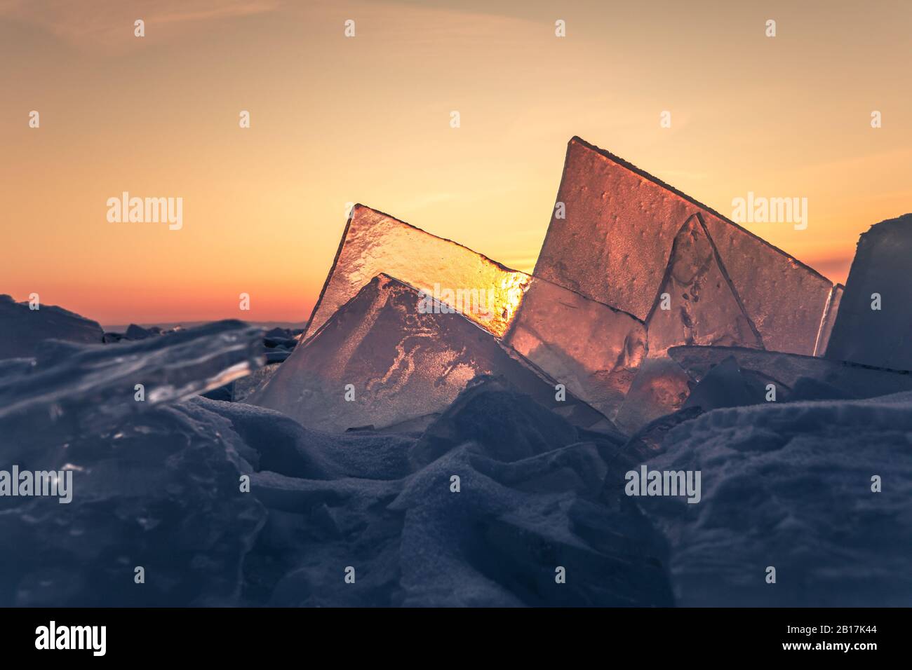Curious yet beautiful ice formations on lake ice at sunrise. Lake ...