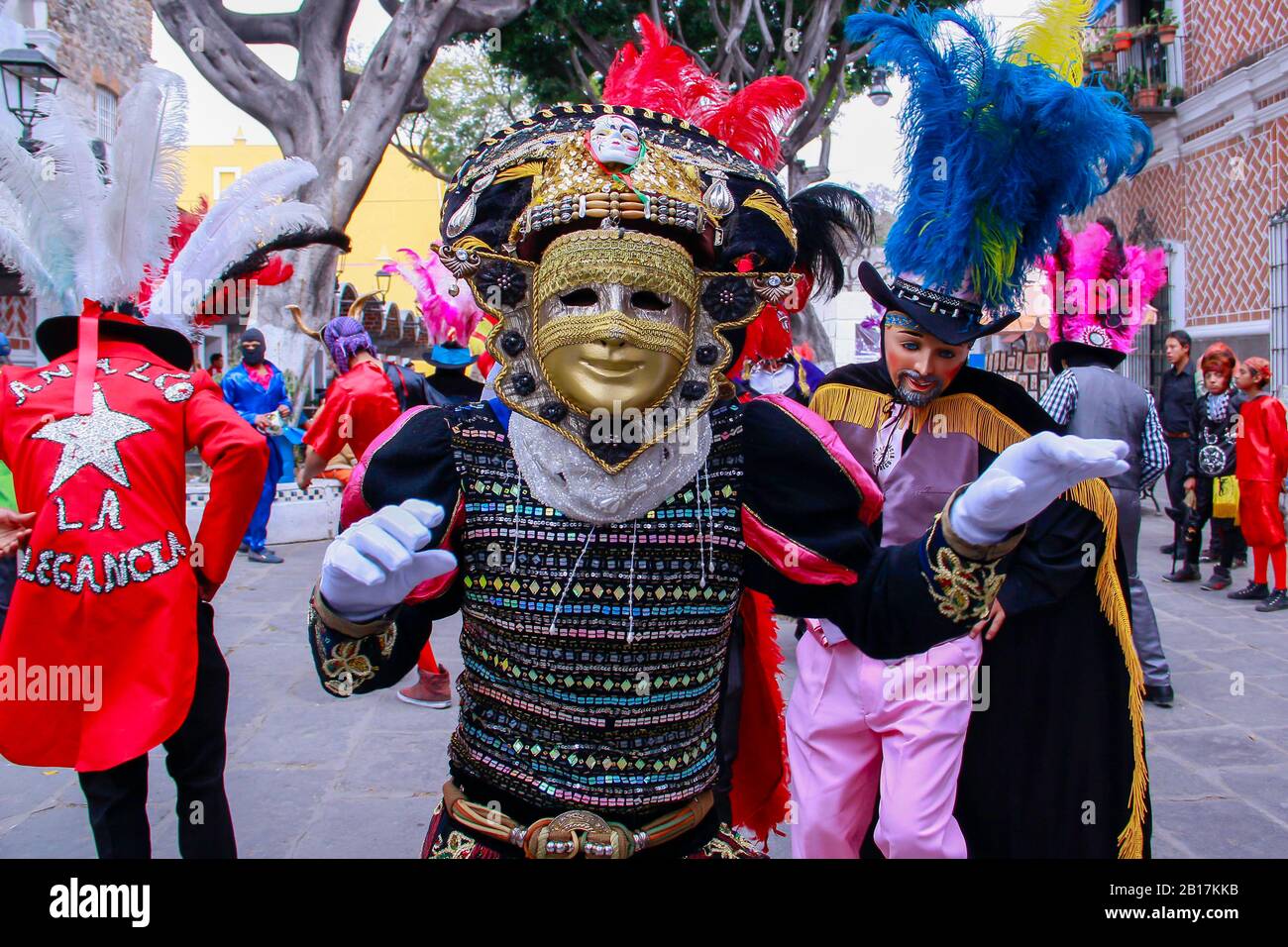 Huehues Mexico, dancer wearing a traditional mexican folk costume and mask rich in color. Carnival scene. Mexican Carnival Stock Photo