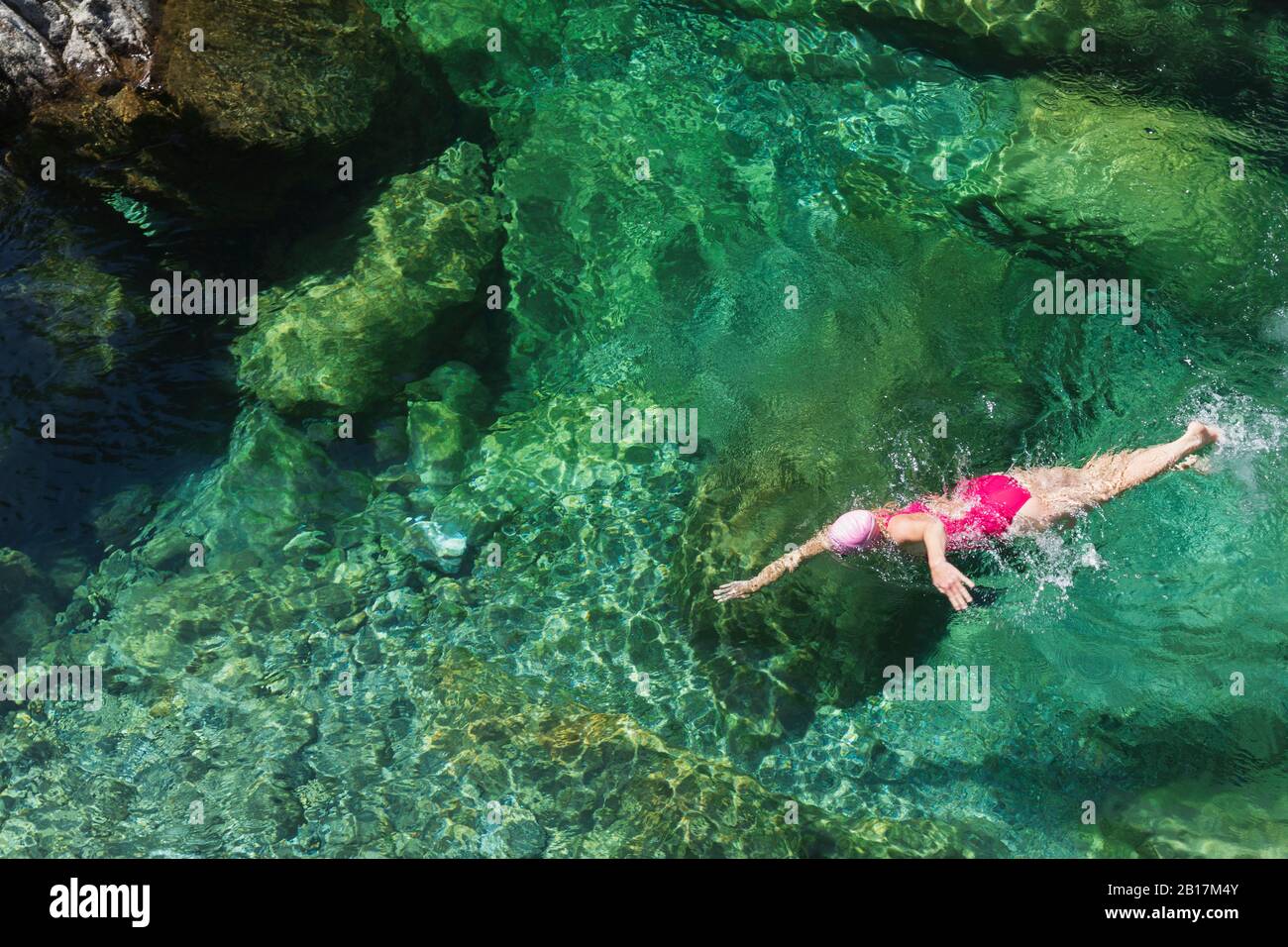 Woman swimming in refreshing Verszasca river Stock Photo